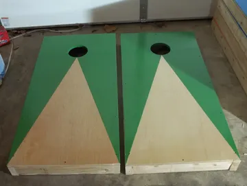 Green trimmed handmade cornhole boards by Paul's Pens n Things