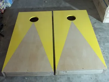 Yellow trimmed handmade cornhole boards by Paul's Pens n Things