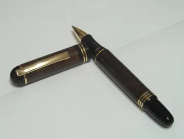 Churchill style rollerball in cocobolo with 24kt gold trim